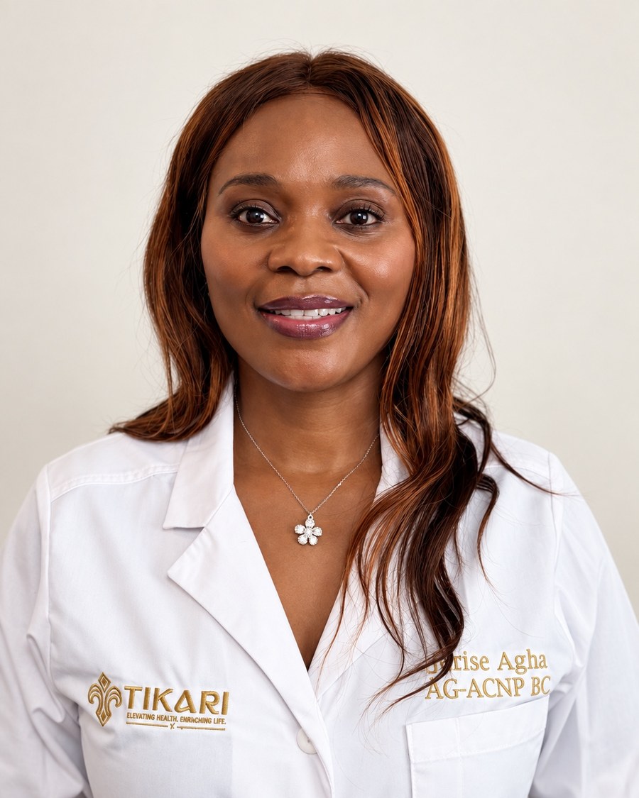 Jerise Agha, MSN, AG-ACNP-BC, wearing a white Tikari clinical coat